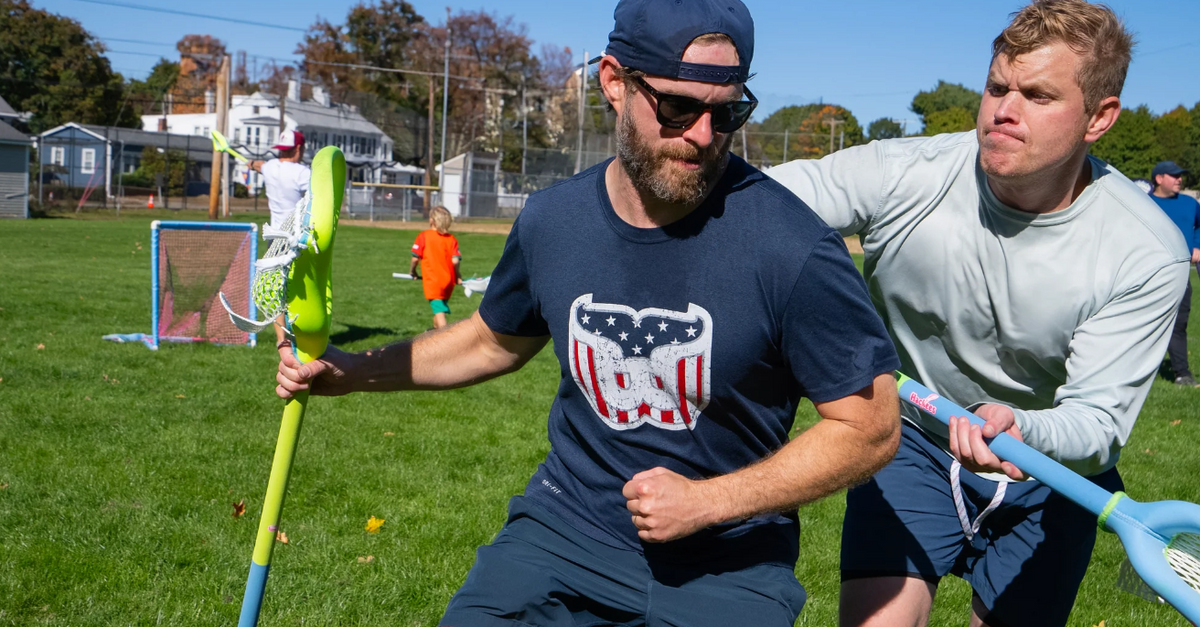 Player running with a Hackees stick